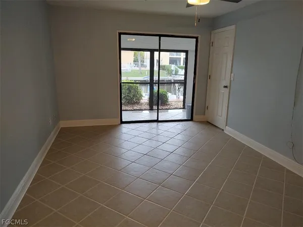 an empty room with a empty space and a window