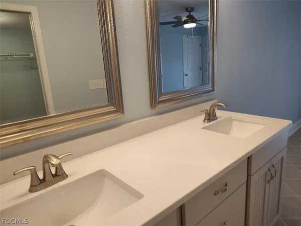 a bathroom with a sink and mirror