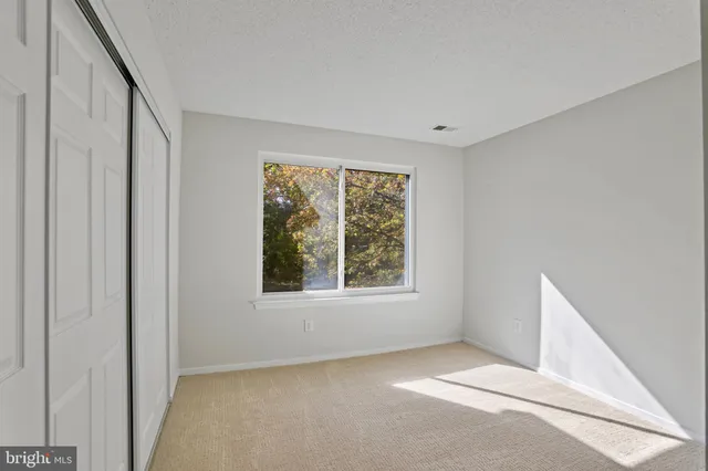 a view of balcony with wooden floor and fence