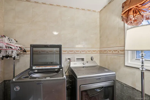 a utility room with dryer and washer