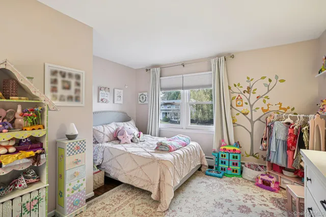 a bedroom with a bed furniture and a window