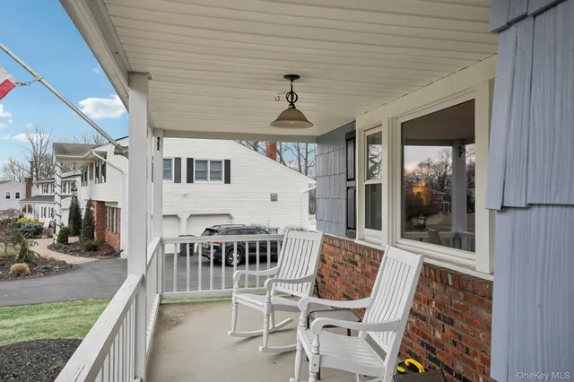 a view of a patio with a table and chairs