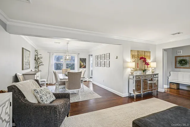 a living room with fireplace furniture and a wooden floor