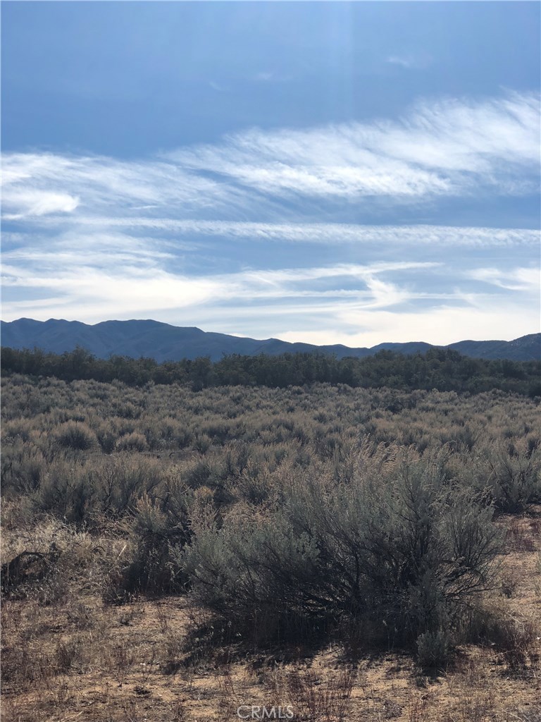 a view of mountain with sunset