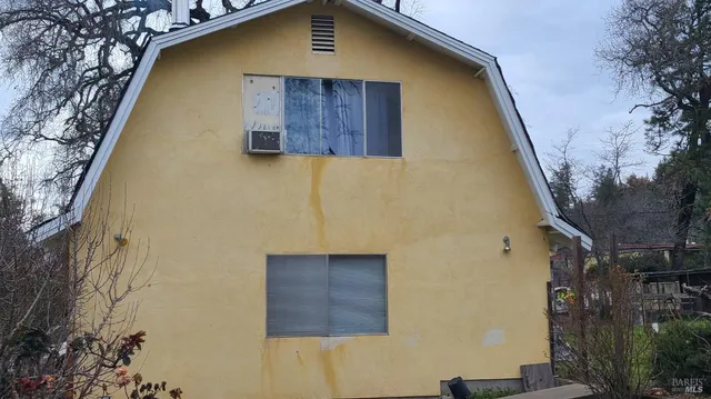 a blue building with a large window