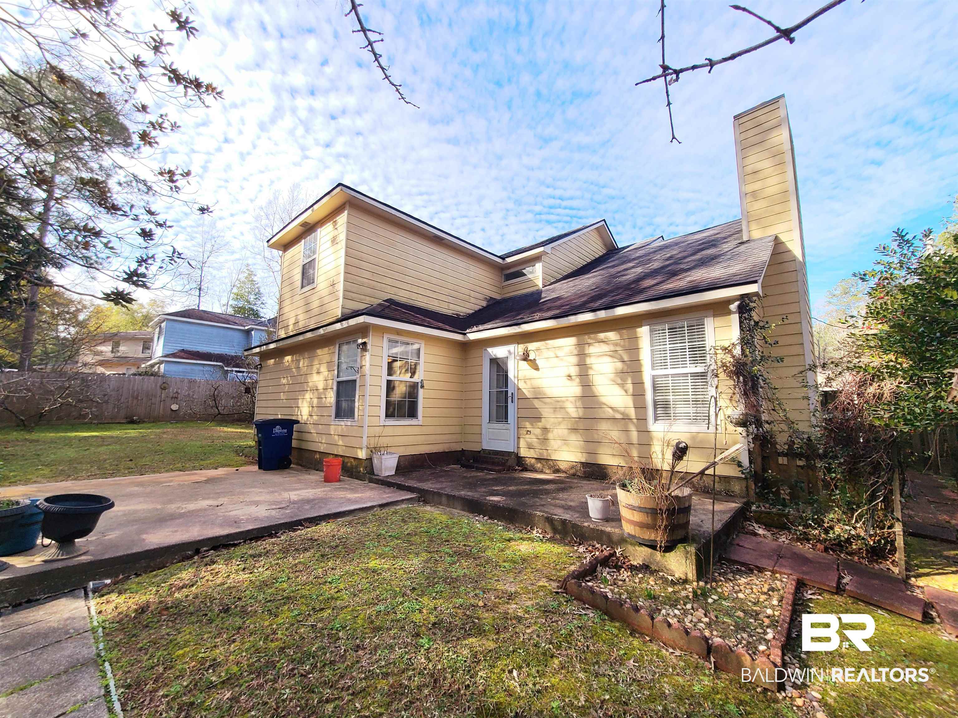 123 Melanie Loop Daphne, AL 36526 - Photo 16 of 17 Back of house with a patio area and a chimney