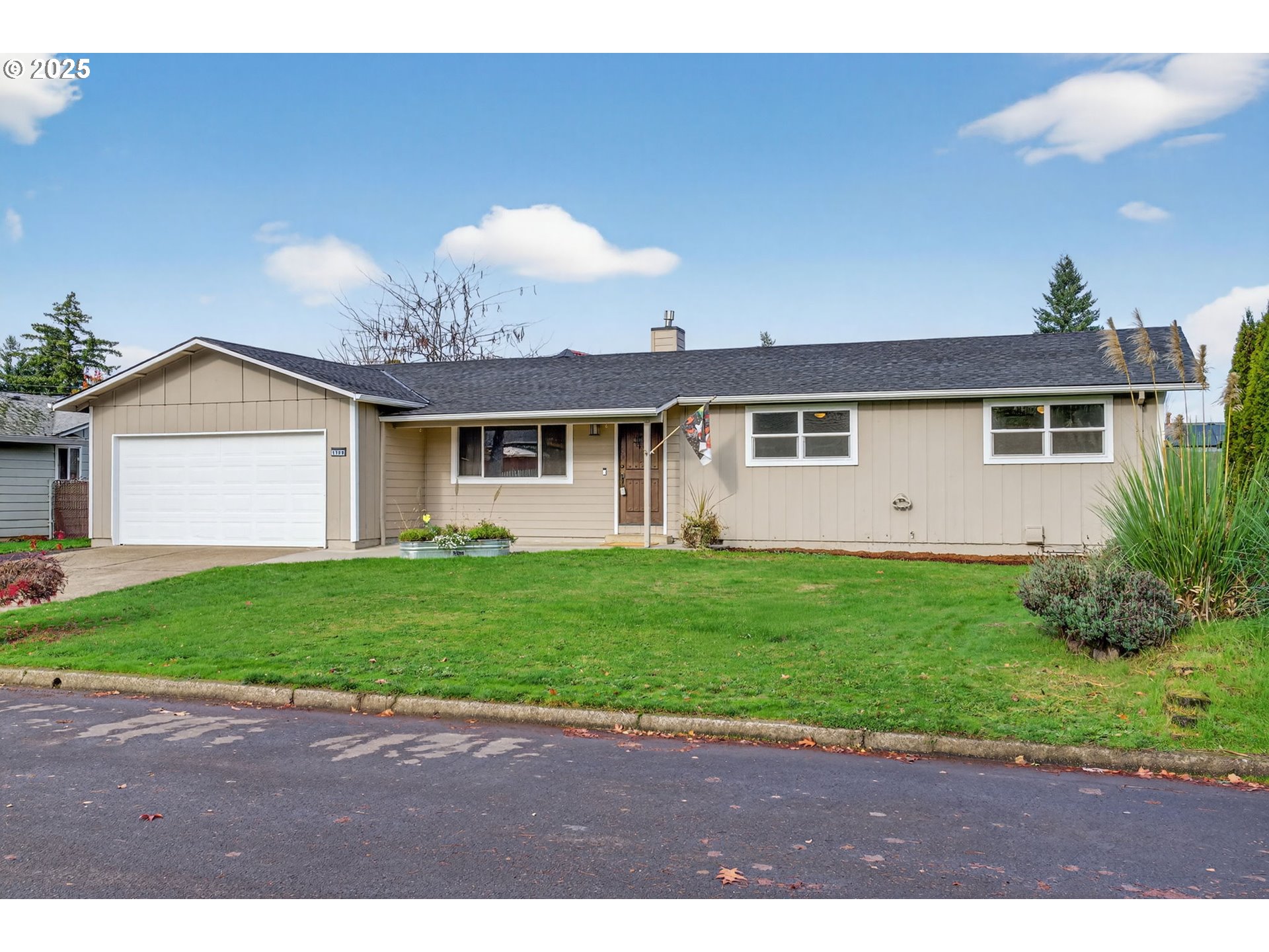 1100 South Ivy Street Cornelius, OR 97113 - Photo 2 of 36 a view of a yard in front of a house with a yard