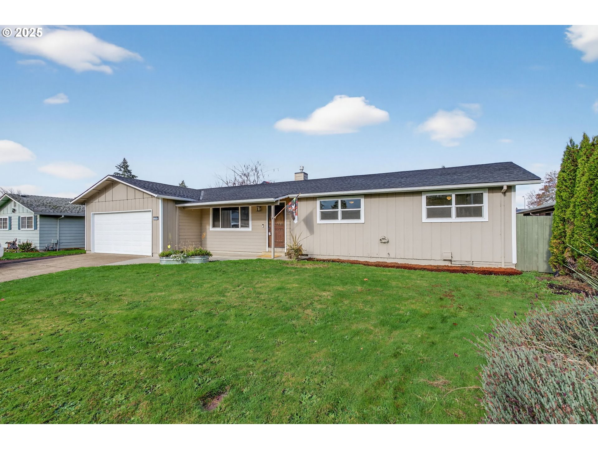 1100 South Ivy Street Cornelius, OR 97113 - Photo 3 of 36 a view of an house with backyard space and garden