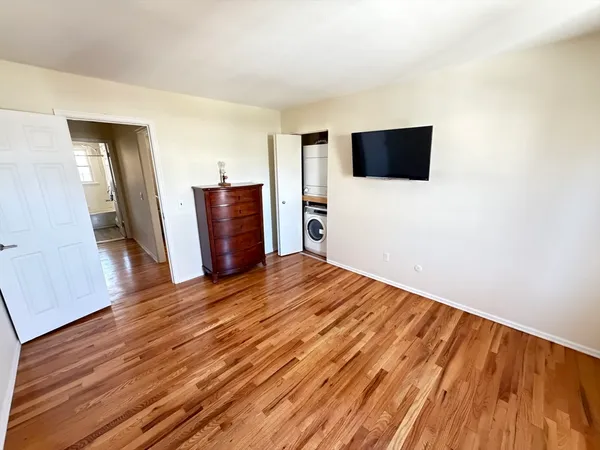 a view of a livingroom with wooden floor