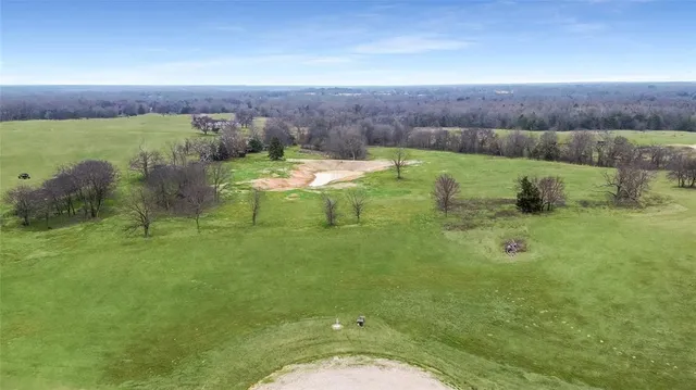 a view of a lake with a yard