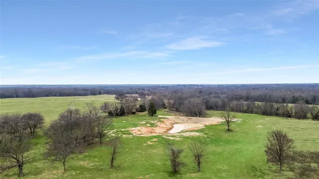 a view of a lake with a yard