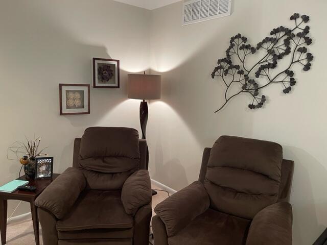 22 Colonial Club Drive, Unit 103 Boynton Beach, FL 33435 - Photo 14 of 41 a living room with furniture and a chair