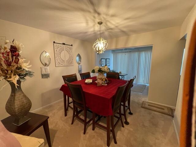 22 Colonial Club Drive, Unit 103 Boynton Beach, FL 33435 - Photo 20 of 41 a dining room with furniture and window