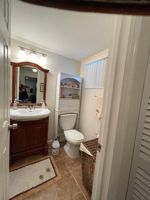 22 Colonial Club Drive, Unit 103 Boynton Beach, FL 33435 - Photo 26 of 41 a bathroom with a sink a toilet and shower