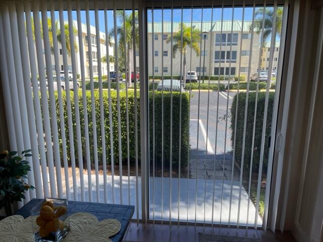 22 Colonial Club Drive, Unit 103 Boynton Beach, FL 33435 - Photo 29 of 41 a view of a balcony with floor to ceiling window