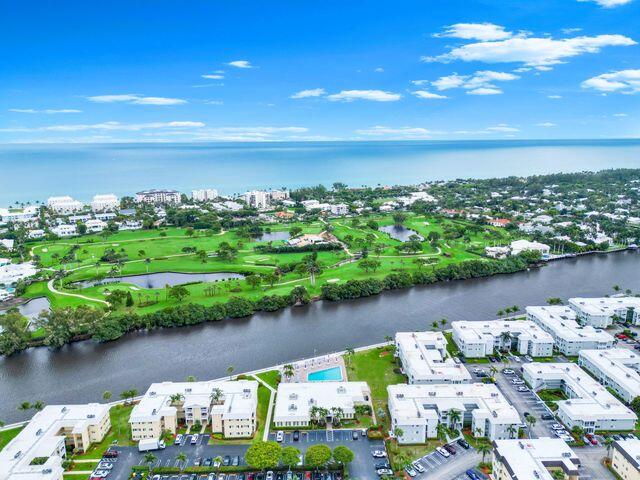 22 Colonial Club Drive, Unit 103 Boynton Beach, FL 33435 - Photo 31 of 41 a view of a lake with a city