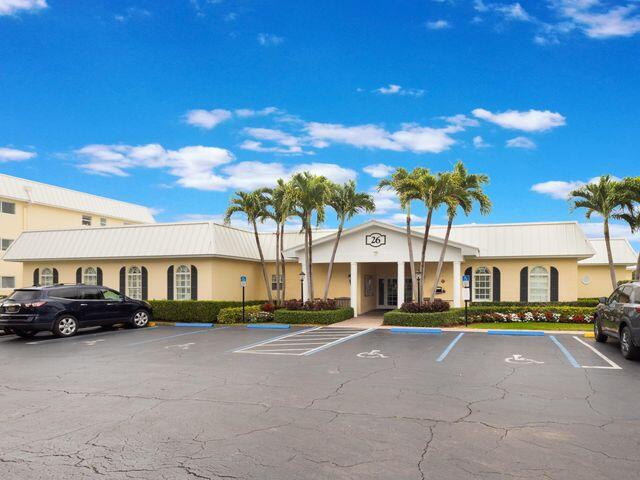 22 Colonial Club Drive, Unit 103 Boynton Beach, FL 33435 - Photo 36 of 41 a front view of a building with street view