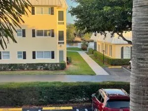 a kitchen with stainless steel appliances granite countertop a refrigerator and a stove