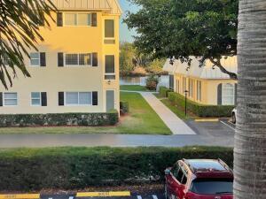 22 Colonial Club Drive, Unit 103 Boynton Beach, FL 33435 - Photo 7 of 41 a front view of a house with a yard