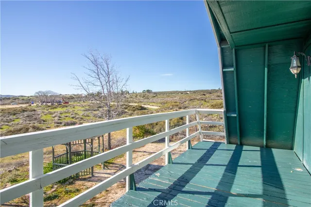 a view of balcony with furniture