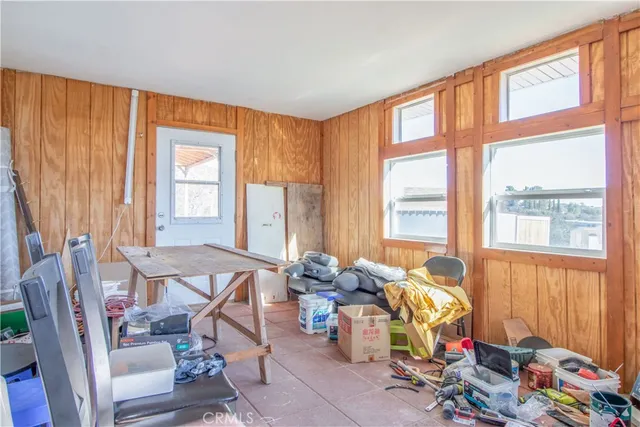 a view of a lush green hillside and houses
