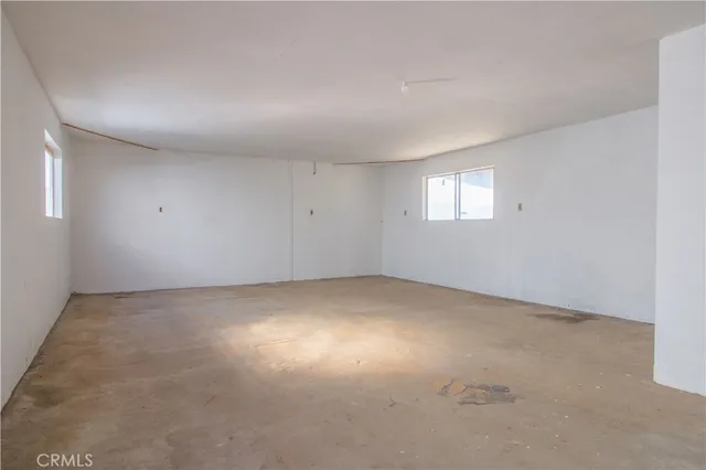 a view of a large body of water with lots of trees in the background