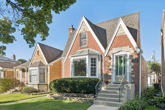 a view of a house next to a yard