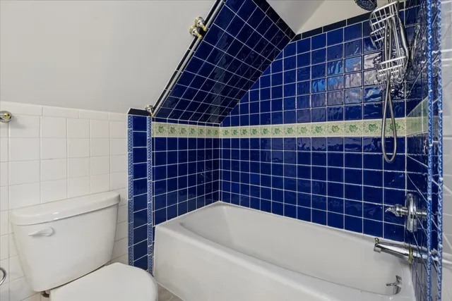 a bathroom with a blue white toilet