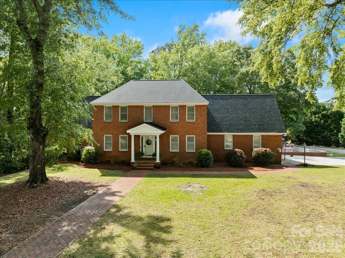 209 Fairway Road Cheraw, SC 29520 - Photo 43 of 48 a front view of a house with a yard
