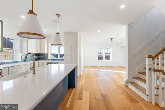 a kitchen that has a sink and a stove