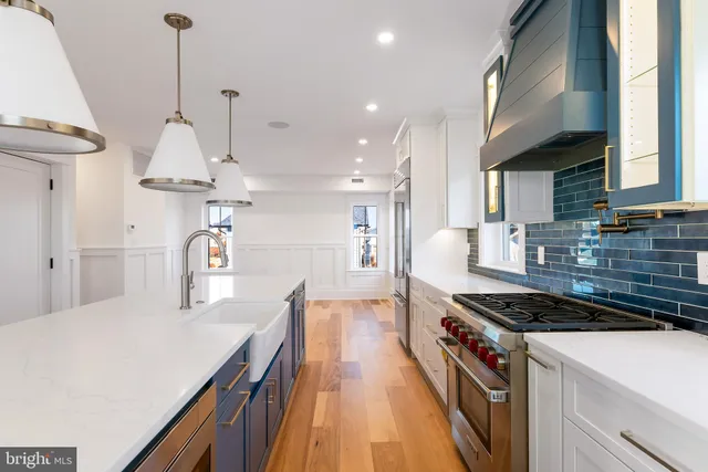a view of an empty room with a window and fireplace