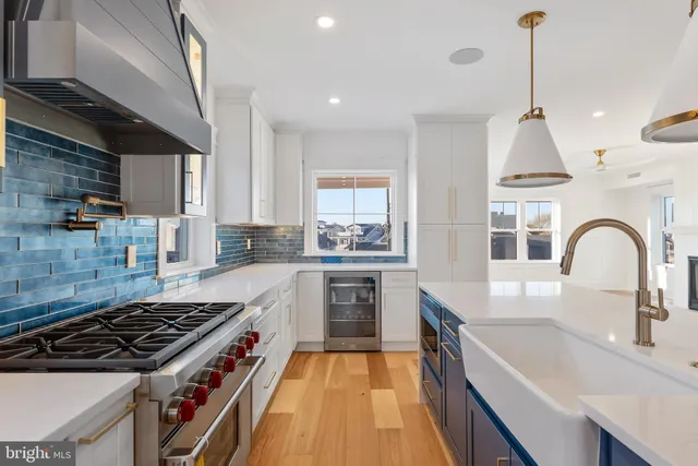 a view of an empty room with exposed radiator and fireplace