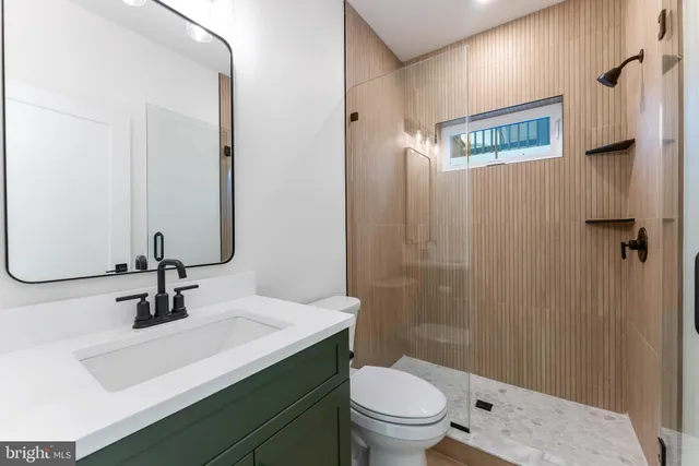 an aerial view of a brick building with many windows