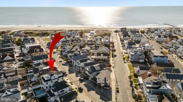 a kitchen with stove a sink dishwasher and a stove with wooden floor