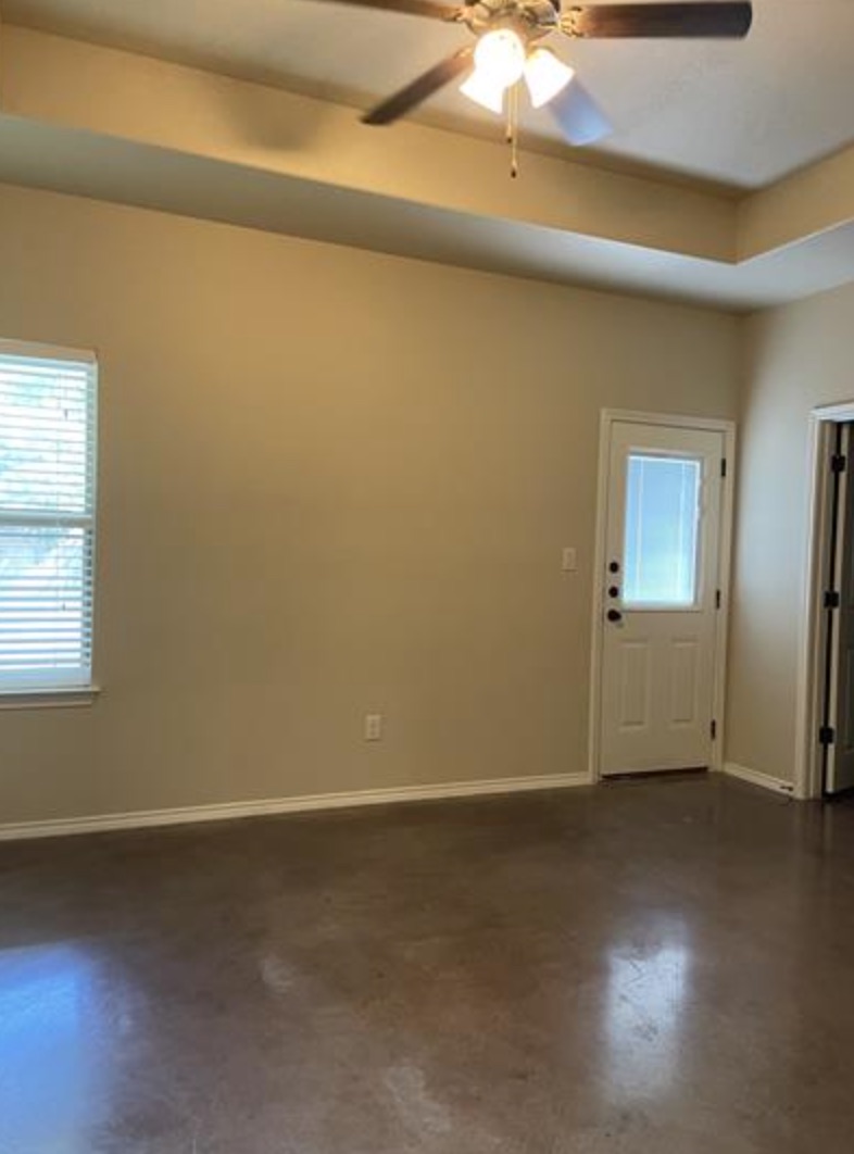 601 Jack Rabbit Lane, Unit B Buda, TX 78610 - Photo 8 of 10 an empty room with a empty space and window