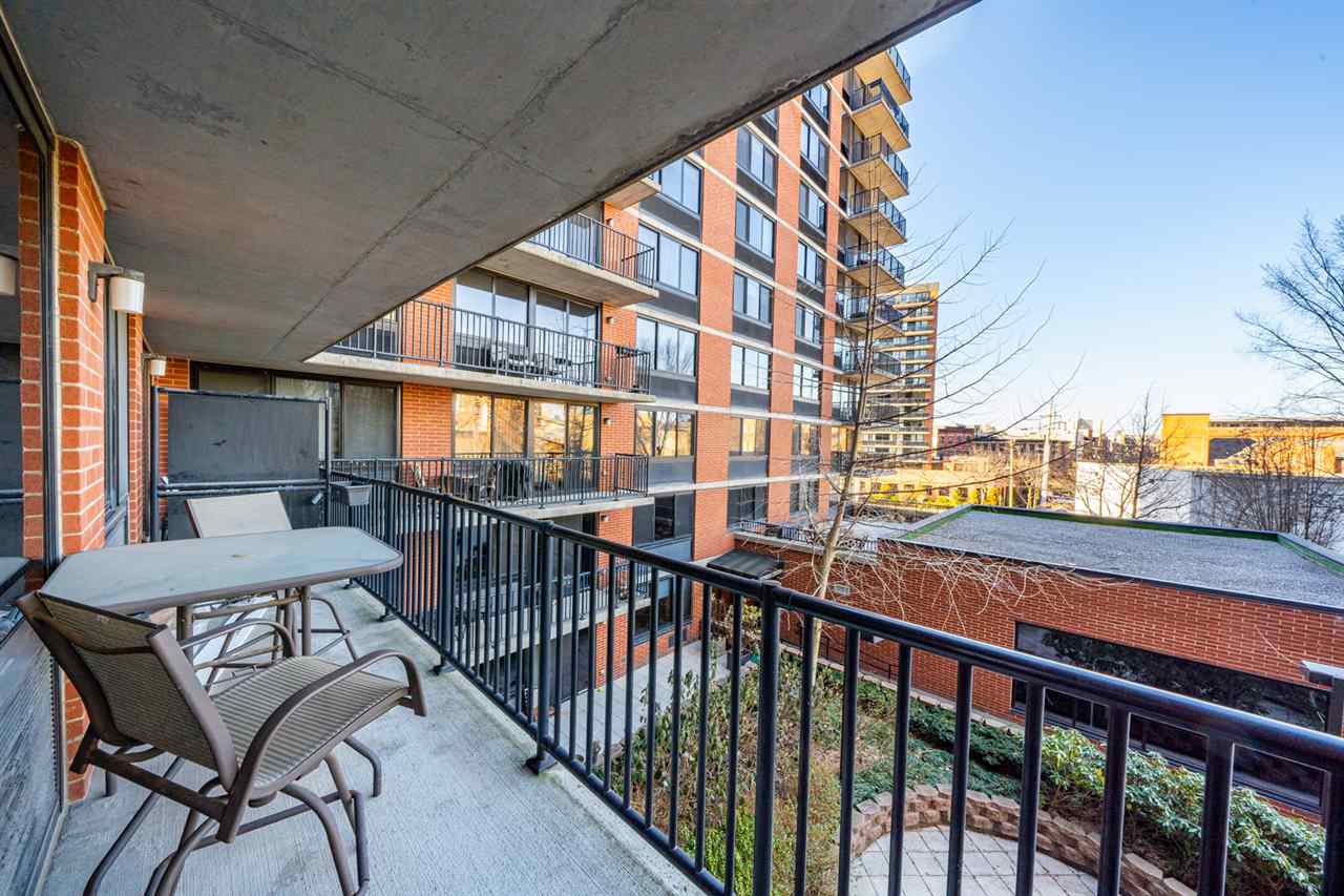 700 Grove Street, Unit 4V Jersey City, NJ 07310 - Photo 6 of 25 a view of a building from a balcony