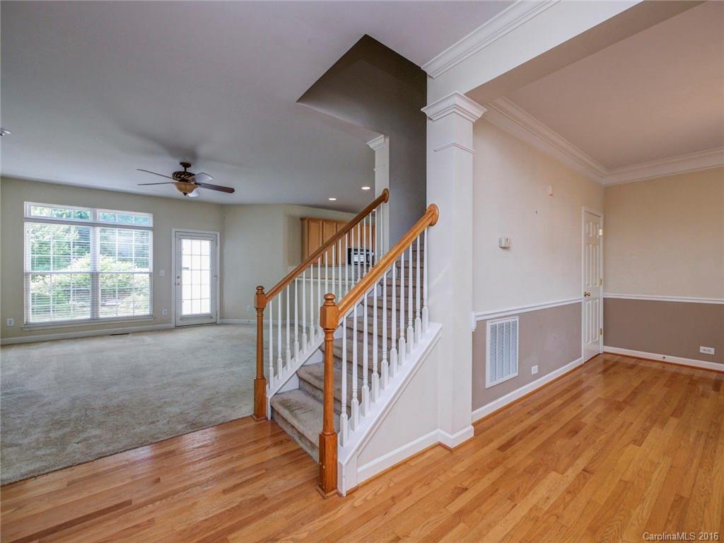 8319 Camberly Road Huntersville, NC 28078 - Photo 2 of 24 a view of a livingroom with wooden floor and stairs