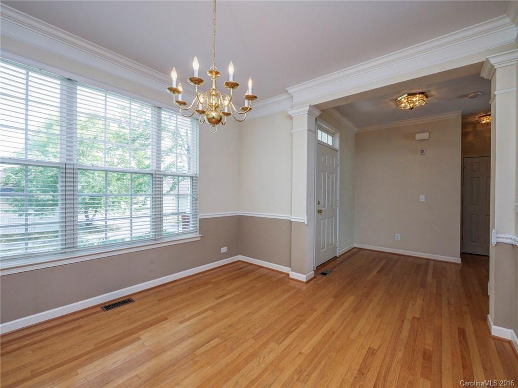 8319 Camberly Road Huntersville, NC 28078 - Photo 3 of 24 an empty room with wooden floor and windows
