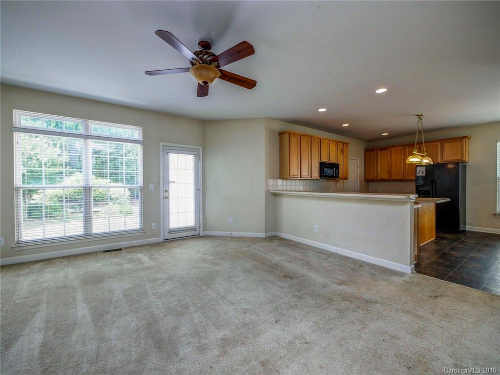 8319 Camberly Road Huntersville, NC 28078 - Photo 6 of 24 a view of a kitchen with a sink and a window