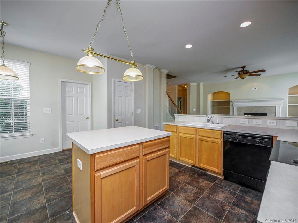 8319 Camberly Road Huntersville, NC 28078 - Photo 10 of 24 a kitchen with a sink stove and refrigerator