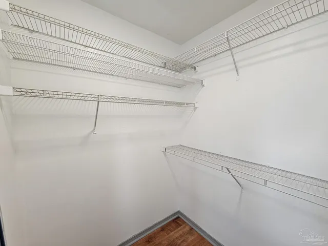 a view of a room with racks on the wall