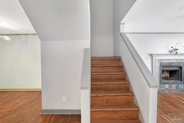 a view of entryway and hall with wooden floor