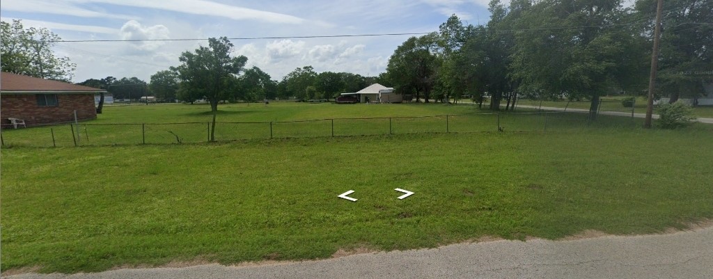 0 14th Street Hempstead, TX 77445 - Photo 2 of 4 a view of a golf course with a play ground