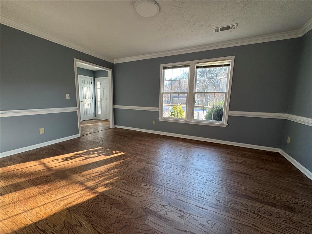 3205 Ivy Station Drive Duluth, GA 30096 - Photo 11 of 38 a view of an empty room with wooden floor and a window