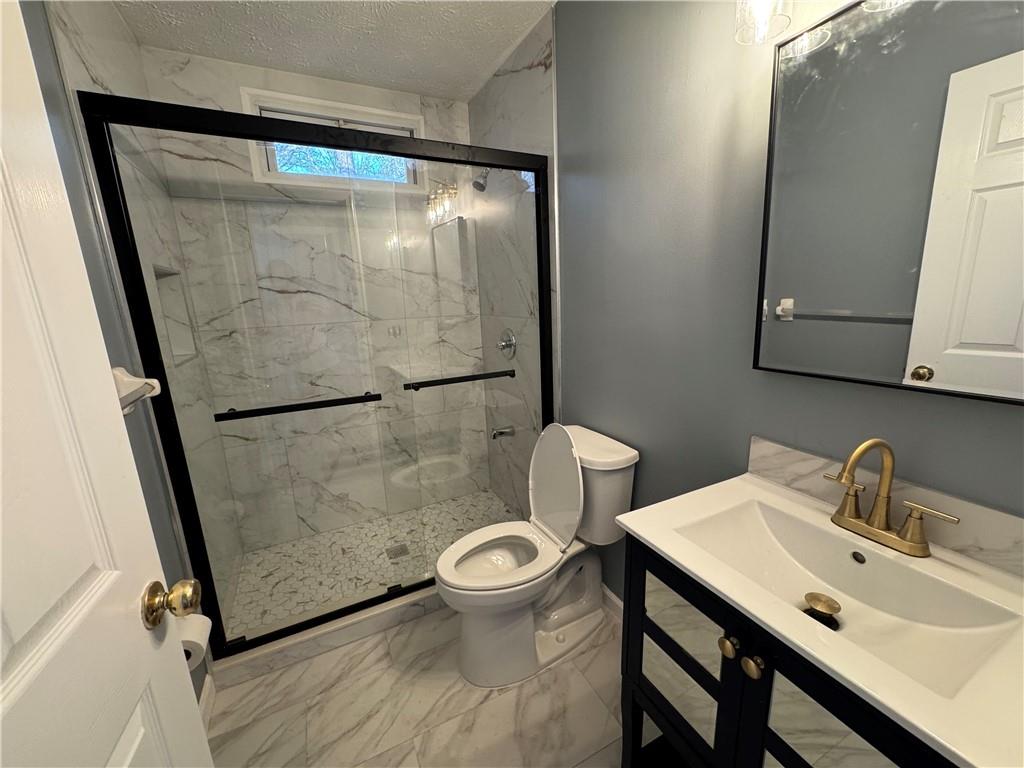 3205 Ivy Station Drive Duluth, GA 30096 - Photo 24 of 38 a bathroom with a sink and a mirror