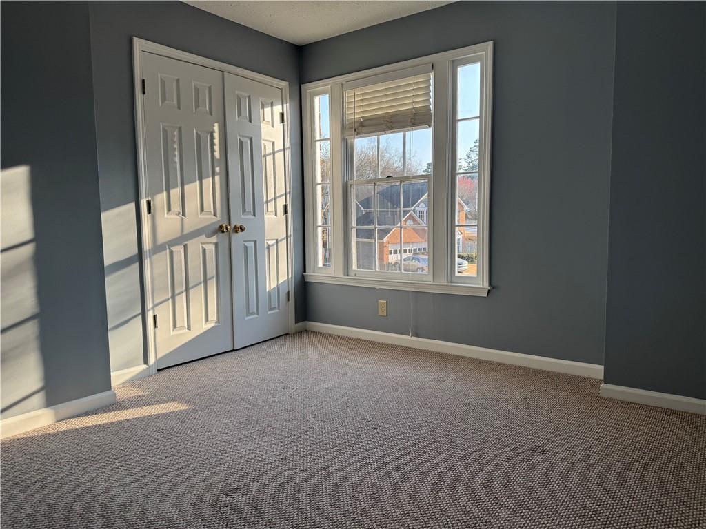 3205 Ivy Station Drive Duluth, GA 30096 - Photo 27 of 38 an empty room with windows