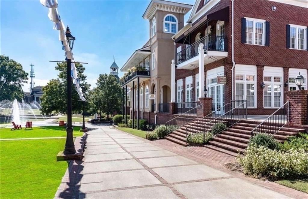 3205 Ivy Station Drive Duluth, GA 30096 - Photo 31 of 38 a front view of a building with garden and trees