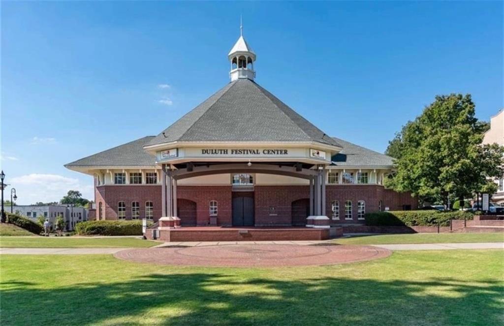 3205 Ivy Station Drive Duluth, GA 30096 - Photo 34 of 38 a front view of a house with a yard