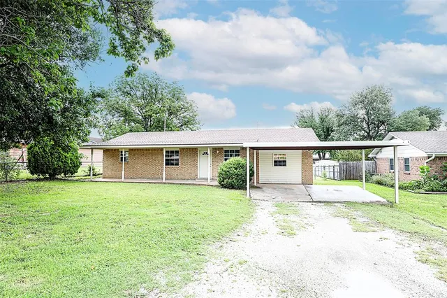 front view of a house and a yard