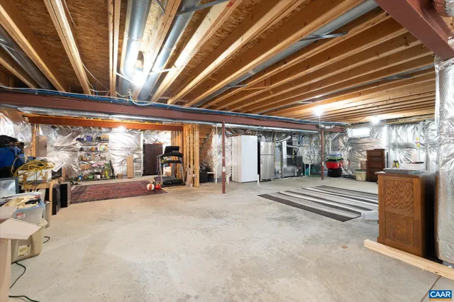 a view of a porch with furniture and a garage